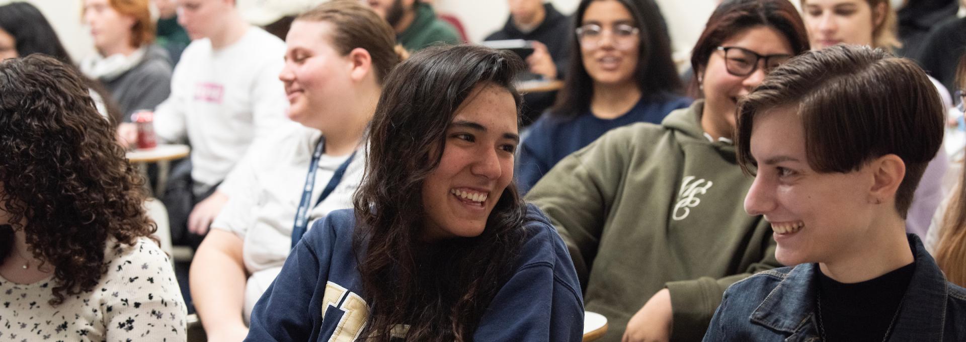 Students in class smiling