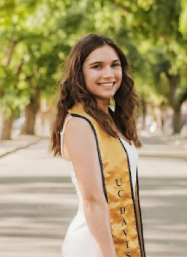 Kendall Richard wearing a graduation sash and cap