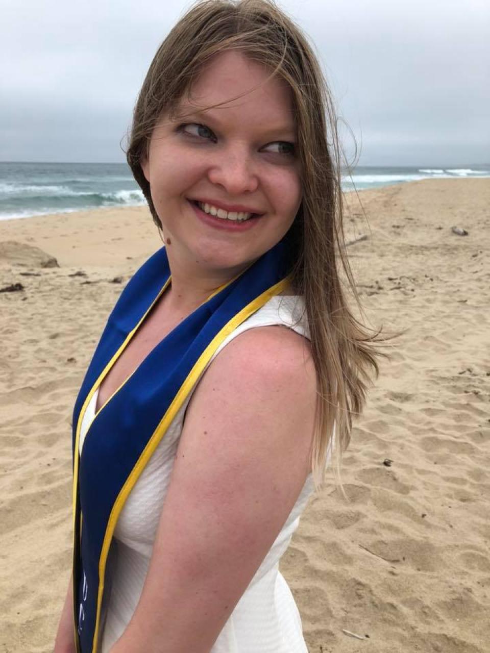 Kristy Pahel MPAc 21 graduation photo on the beach