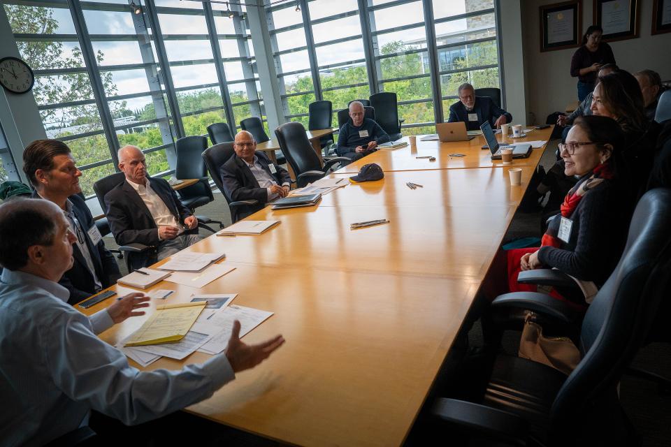 council members in a conference room at Gallagher Hall