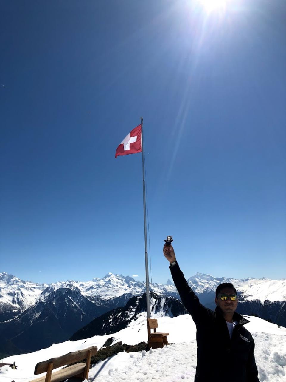 UC Davis Mascot, Gunrock, and MBA student Albert Contreras celebrate reaching the scenic overlook to Aletsch Glacier