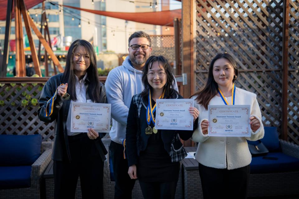 MSBA Hackathon winners hold up their certificates 