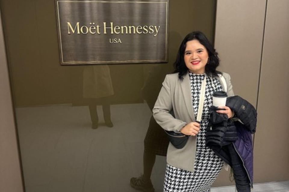 Marisol Ibarra standing in front of Moet Hennessay